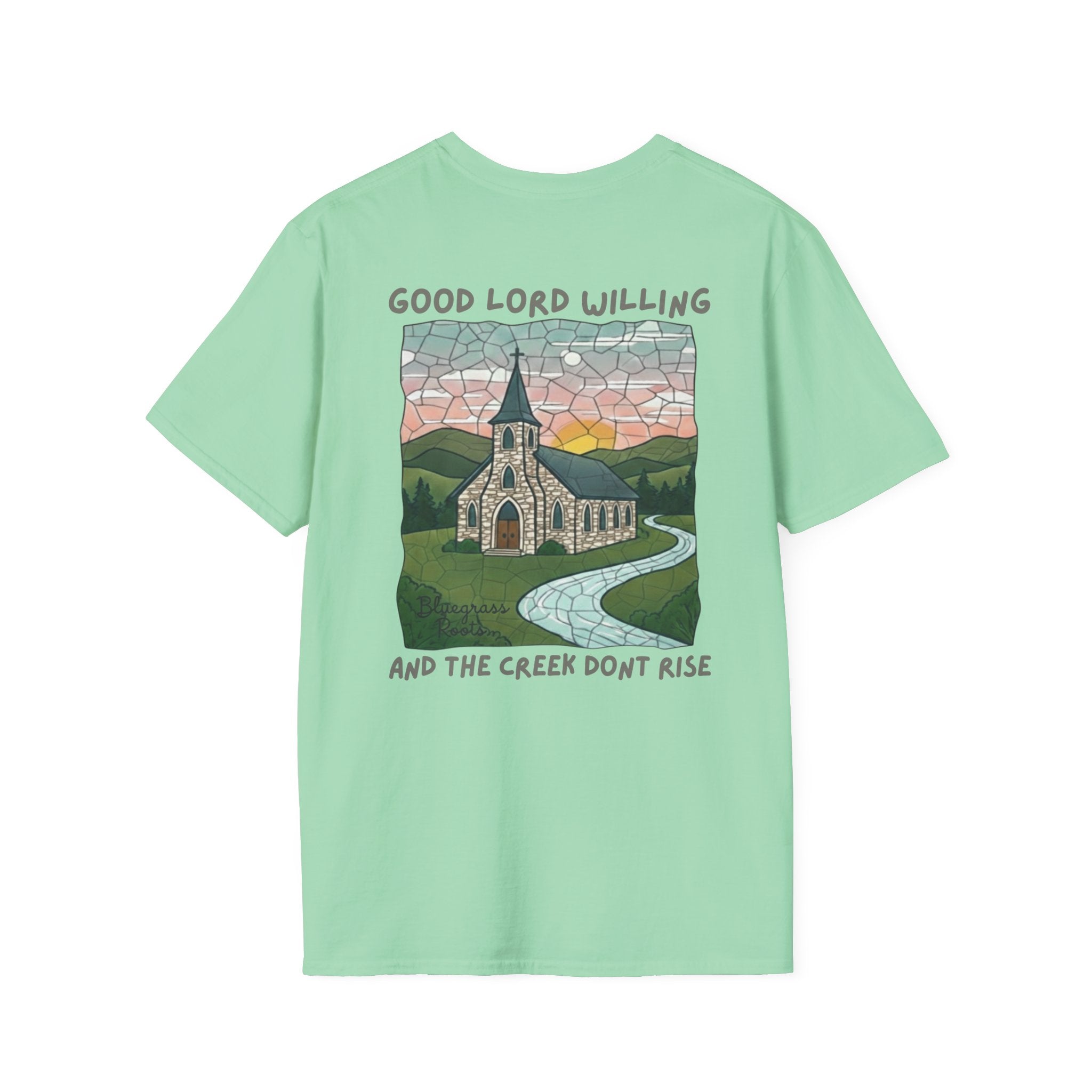 Light green t-shirt with a graphic design of a church and mountains on a white background