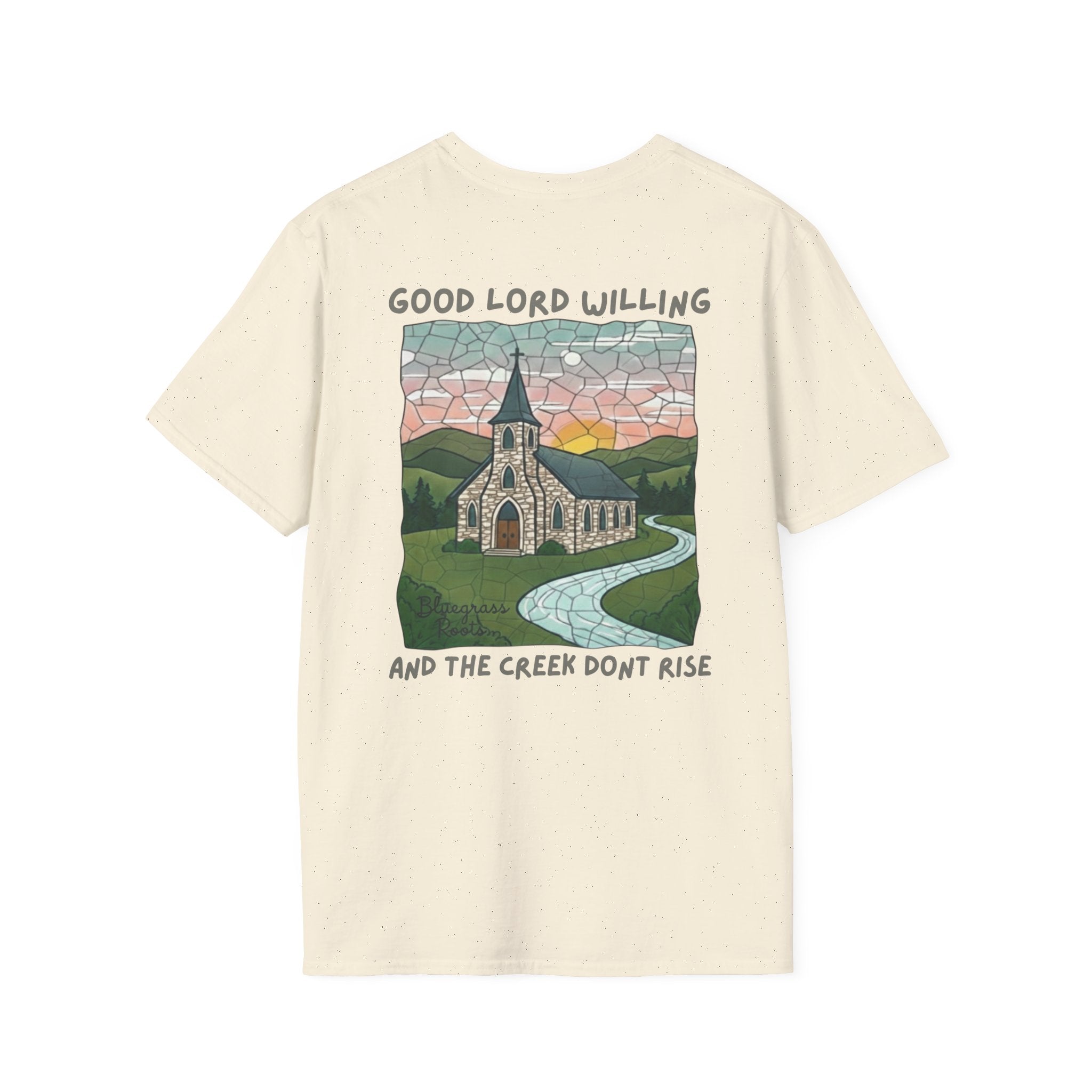 Beige t-shirt with a graphic of a church and landscape on a white background