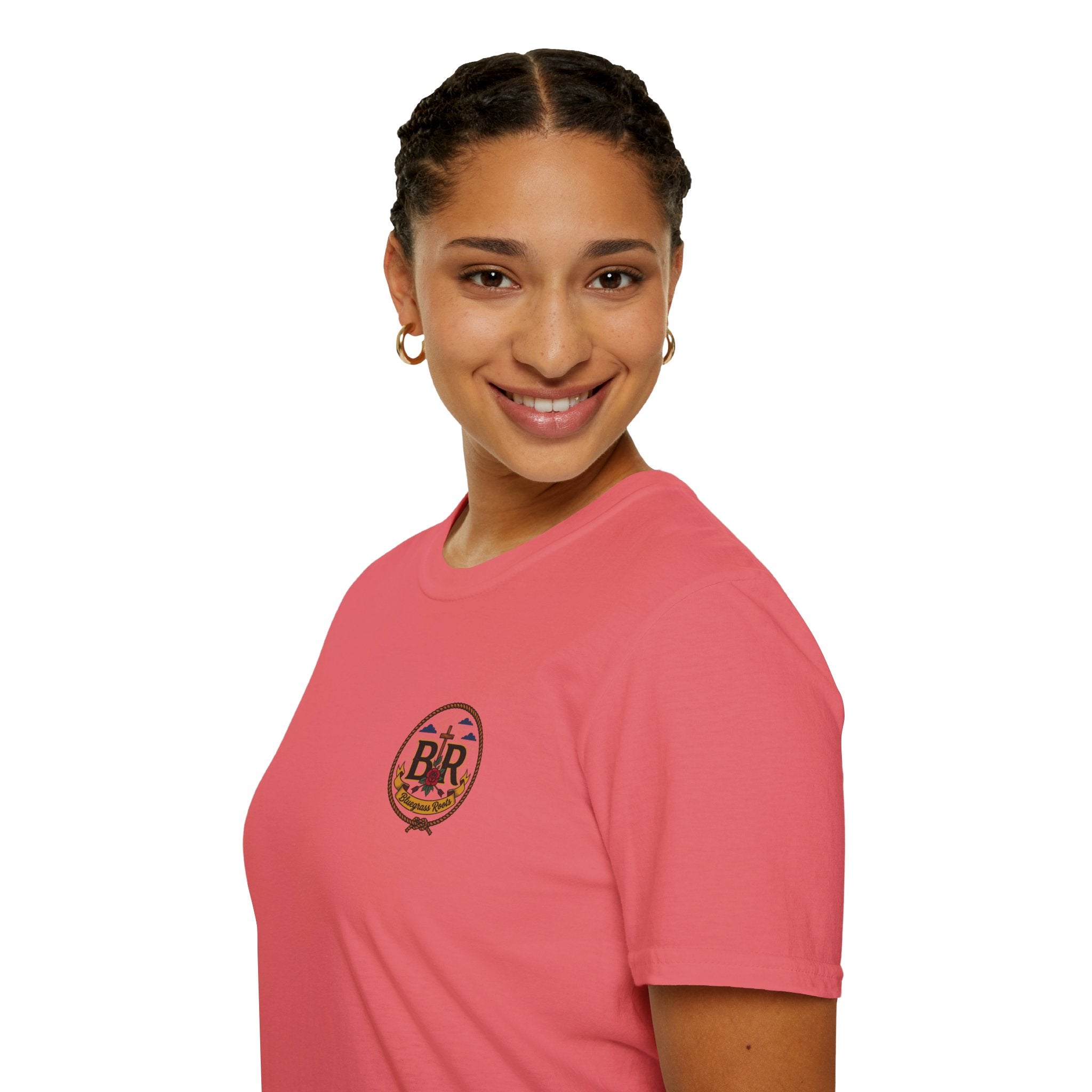 Woman wearing the Bluegrass Roots Prayed Up Laced Up Fed Up cowgirl boot tee in Coral Silk, standing pose