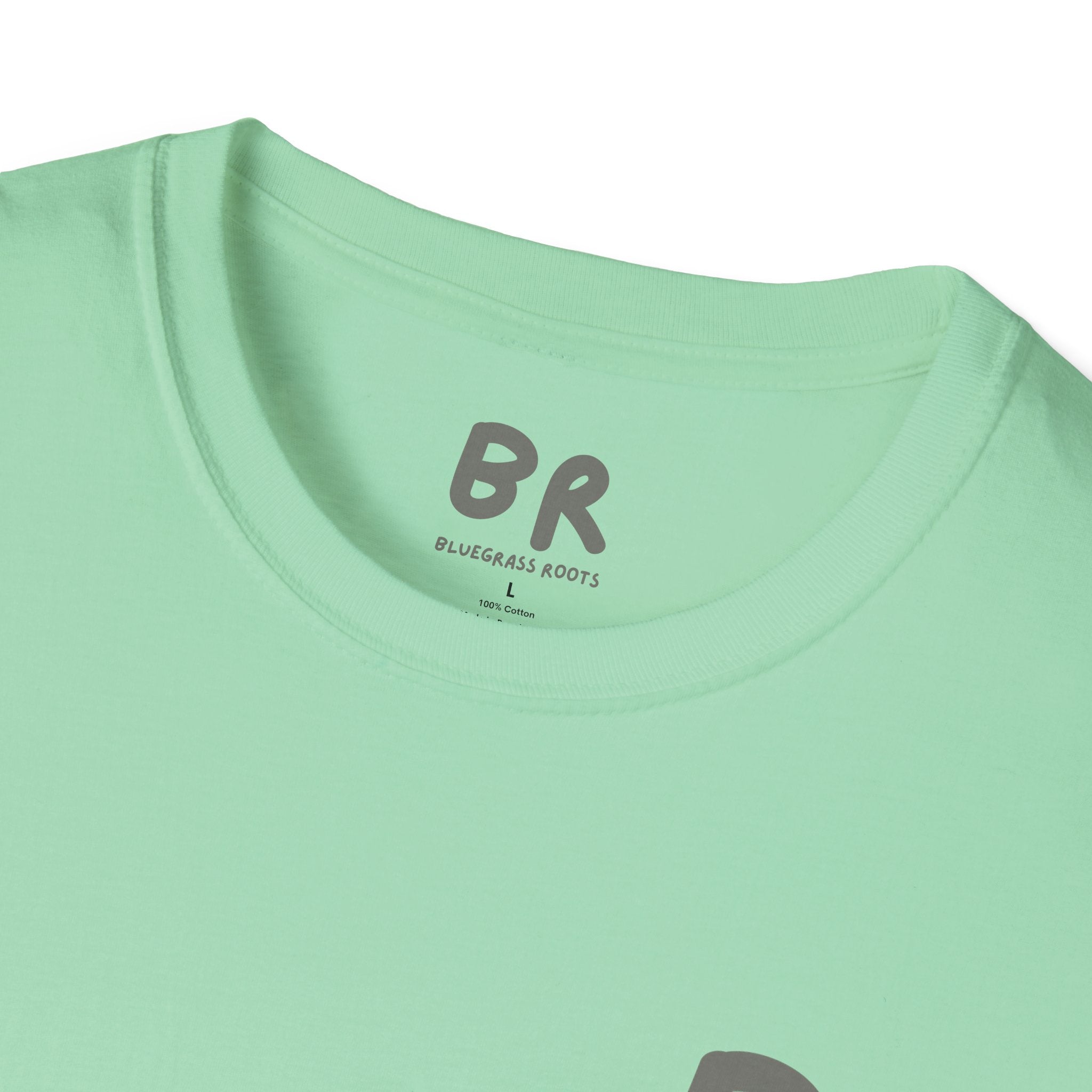 Close-up of a light green t-shirt with 'BR' logo and text on a white background