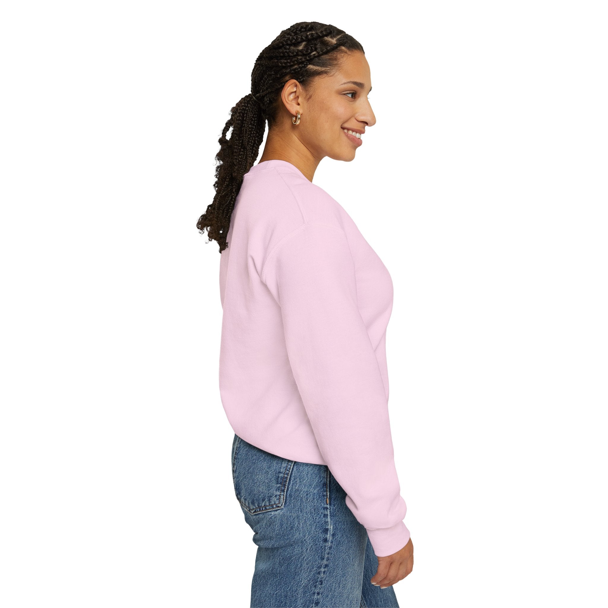 Woman wearing a pink sweatshirt and blue jeans on a white background