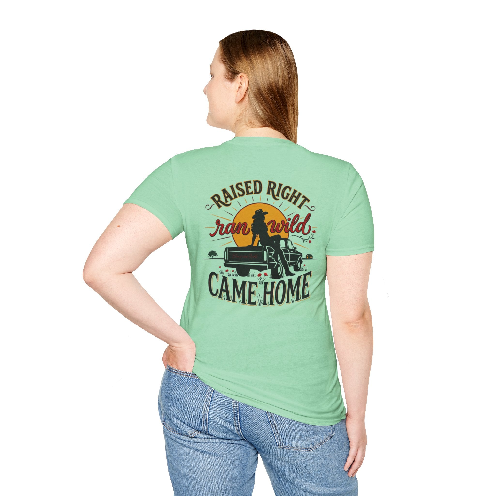 Woman wearing the Bluegrass Roots Raised Right Ran Wild Came Home sunset tailgate tee, standing pose
