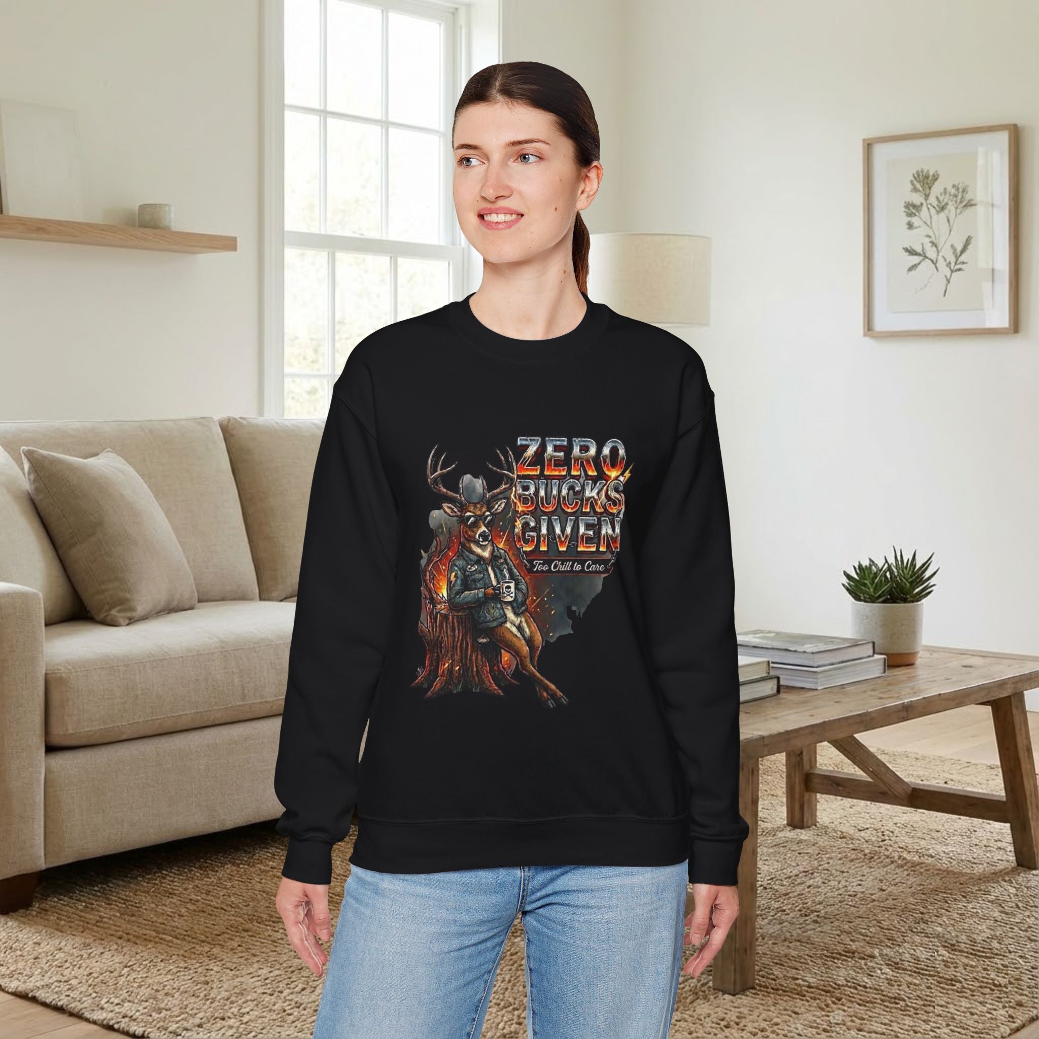 Woman wearing a black sweatshirt with a graphic design in a living room.