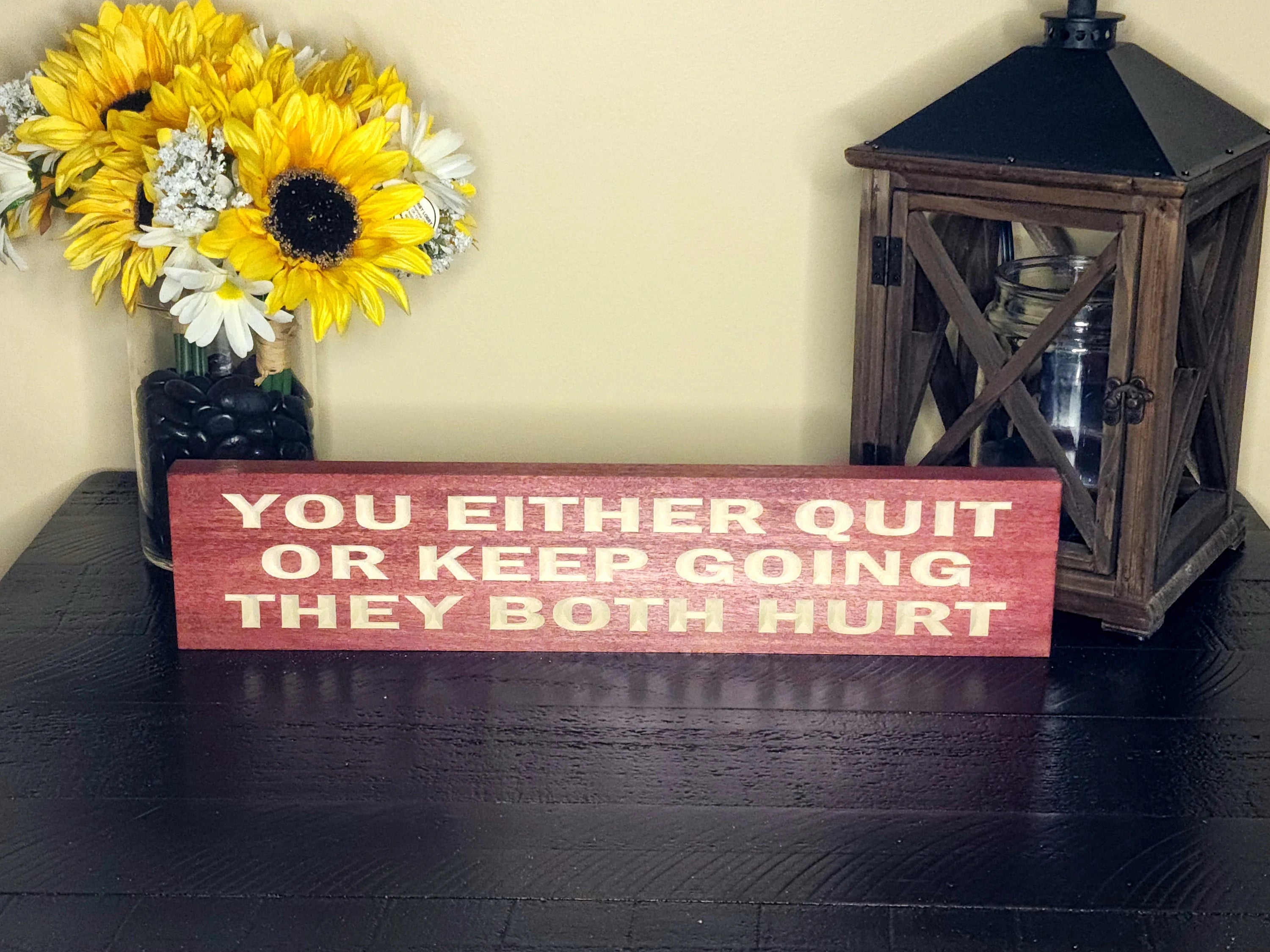 Inspirational quote sign for perseverance and determination in home or gym