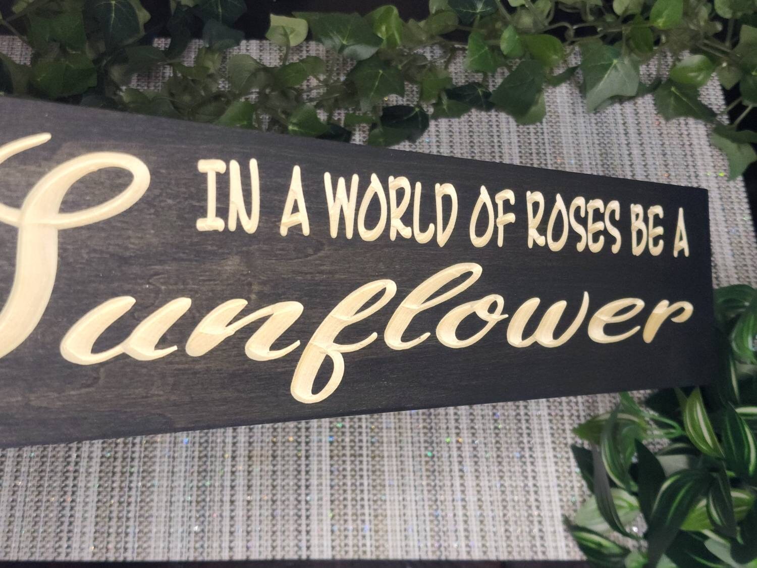 Motivational sunflower-themed wooden sign used as gift decor for nature lovers.