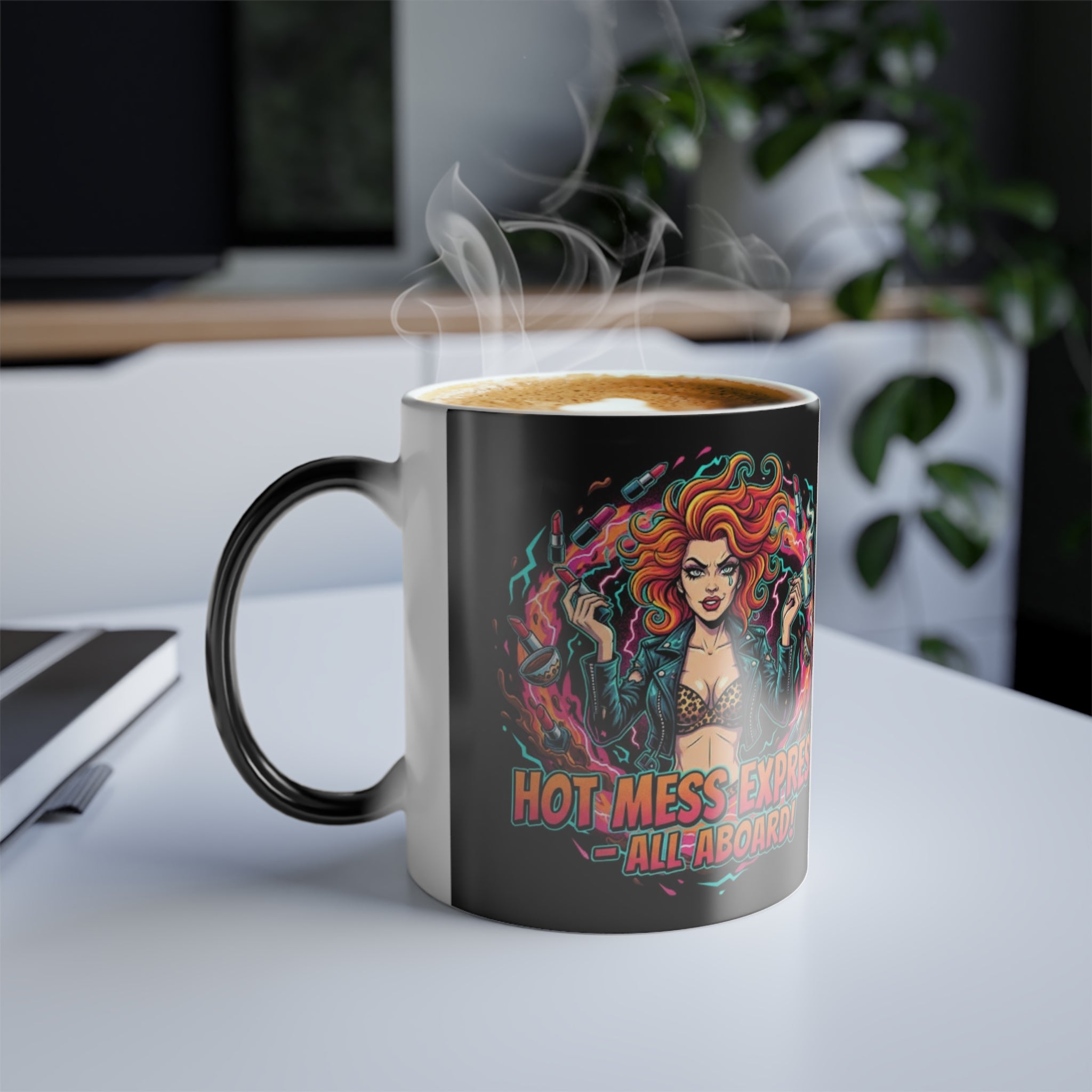 Mug with colorful design and text on a desk with steam rising from it