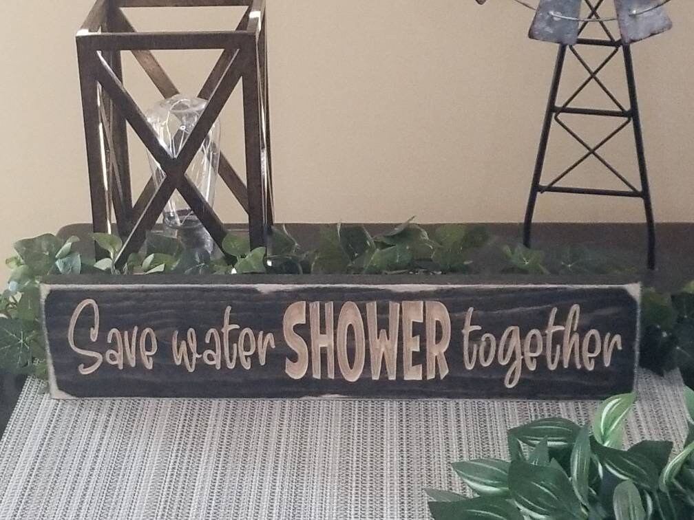 Personalized wooden bathroom sign with farmhouse-style finish options.