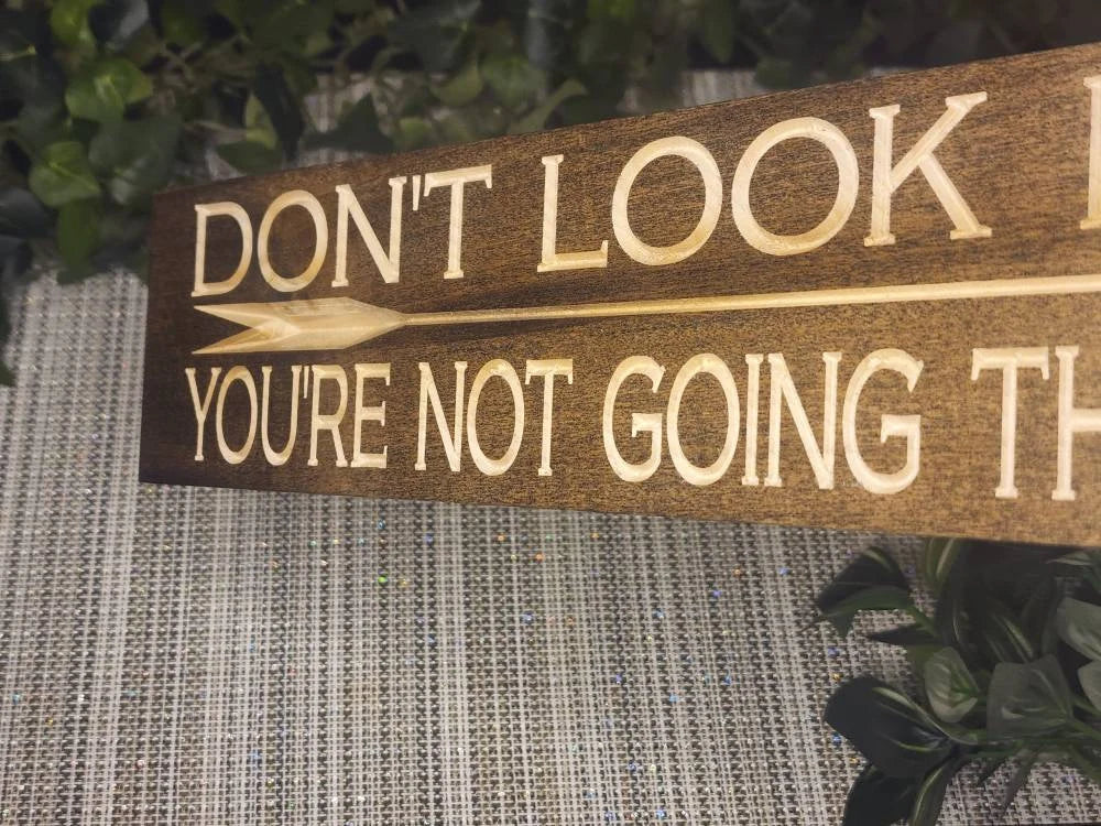 Uplifting wooden wall decor placed in a modern workspace for daily motivation.