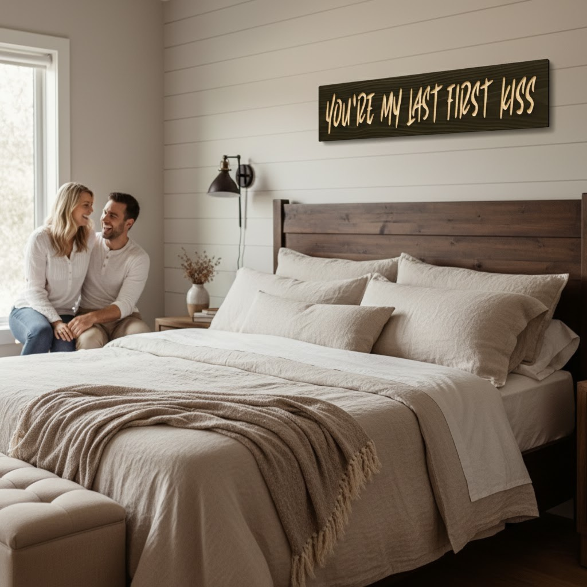 “You’re My Last First Kiss” romantic quote wood sign displayed above a bed in a cozy farmhouse bedroom.