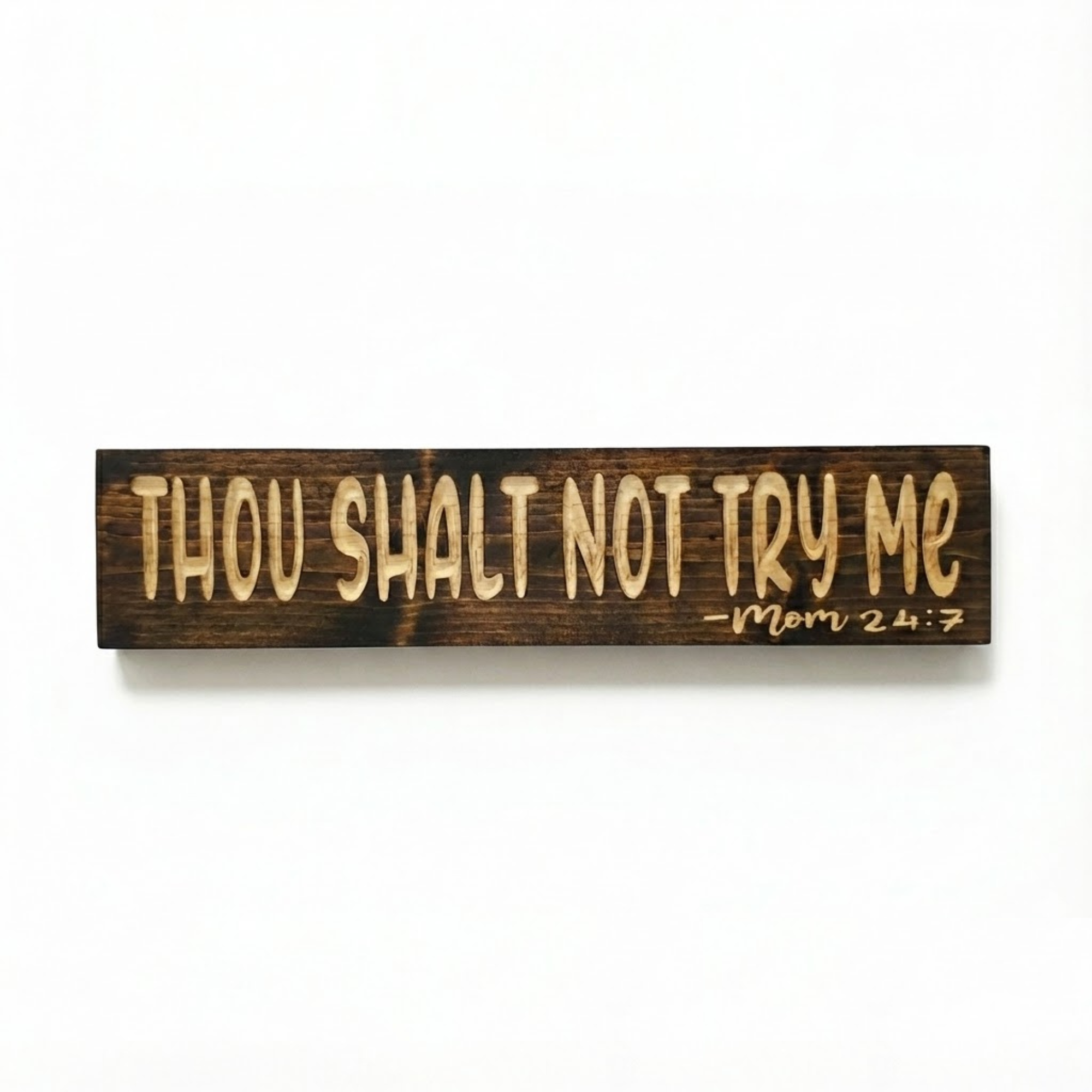 Front view of the Bluegrass Gifts solid wood sign deeply carved with the phrase "Thou Shalt Not Try Me - Mom 24:7" in a dark walnut finish.