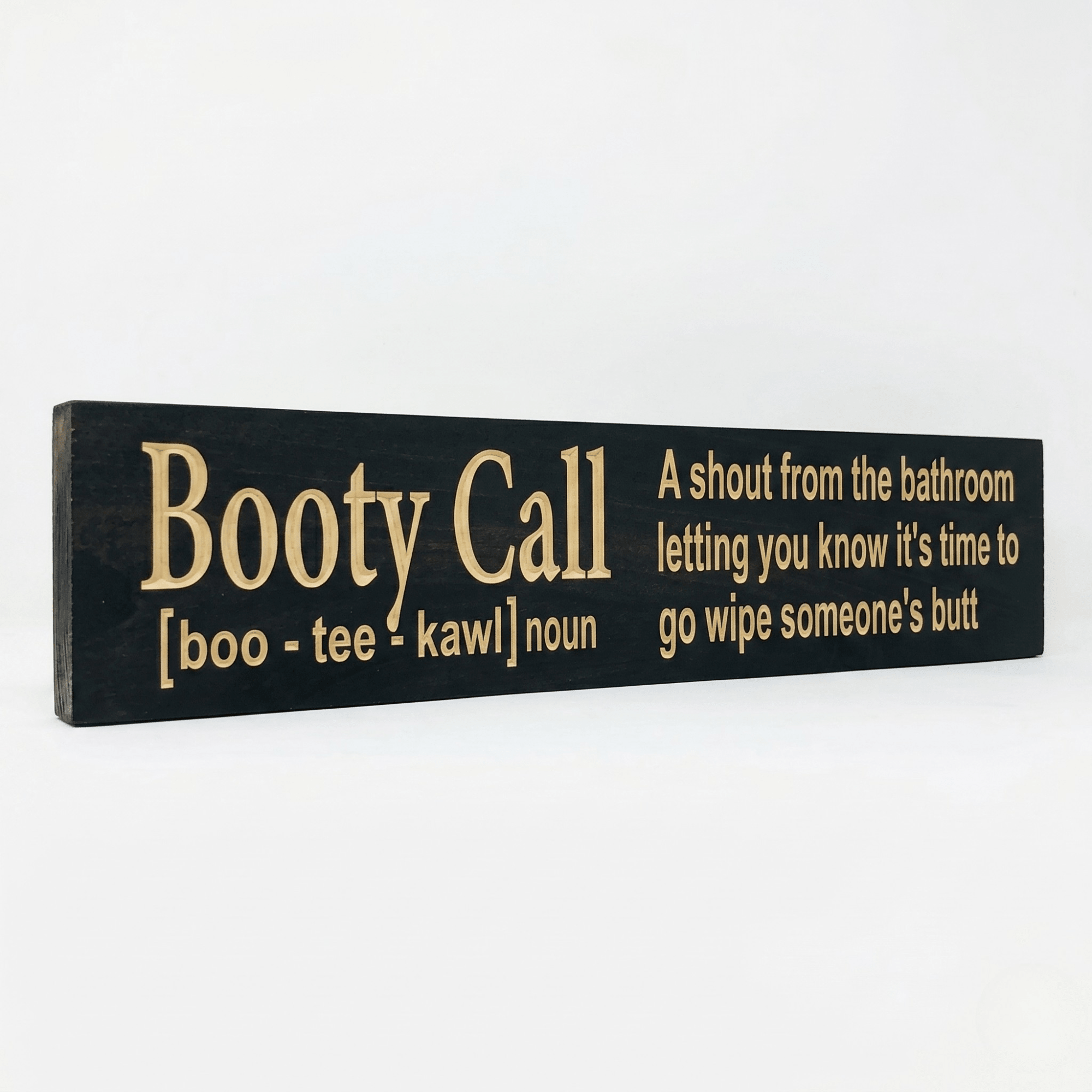 Angled view of the Booty Call funny parenting bathroom sign showing dimensional CNC-carved letters and rich Ebony stain on solid Pine