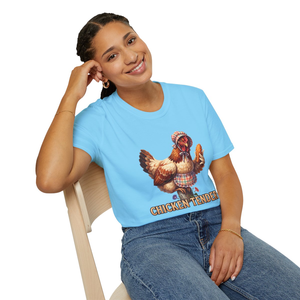 A woman sits on a chair, smiling and looking left, wearing a light blue Chicken T Shirt - Chicken Tender from Bluegrass Gifts