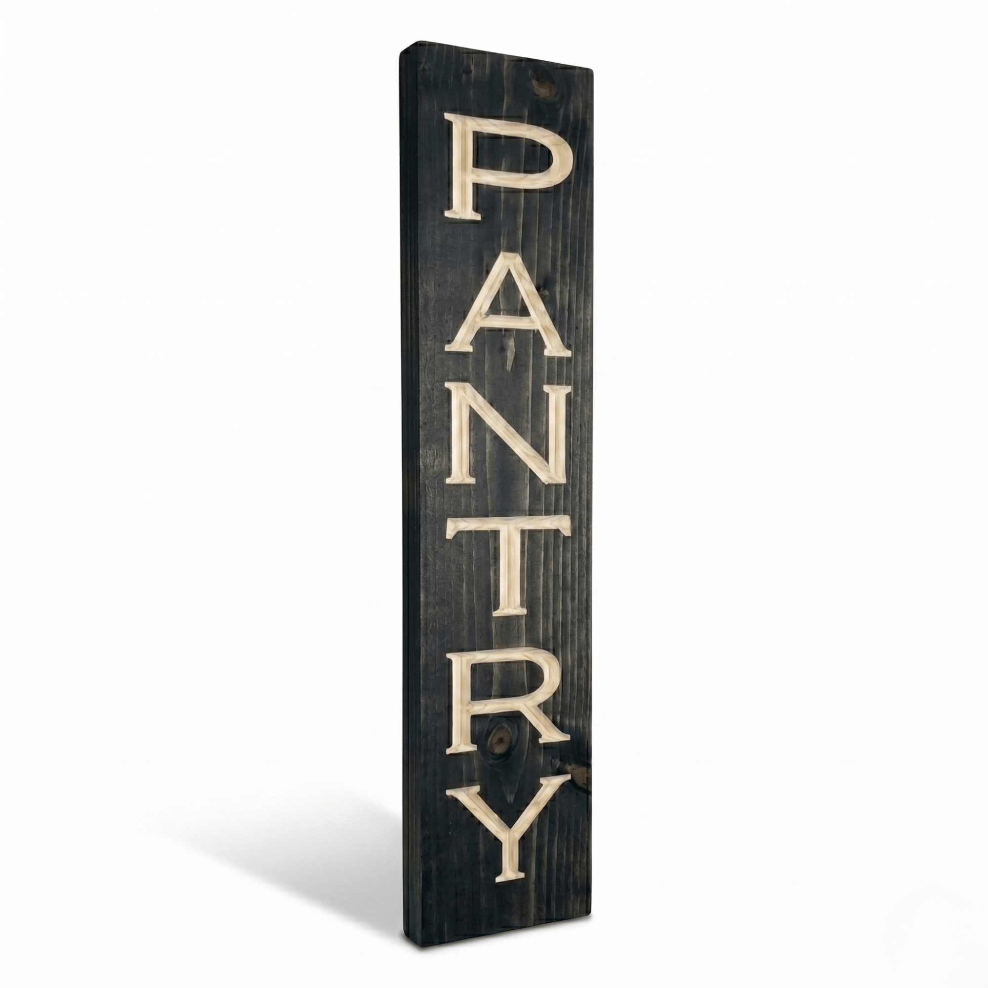 Side angle view of the vertical pantry wood sign showing dimensional CNC carved letters and solid pine thickness in dark ebony stain finish.