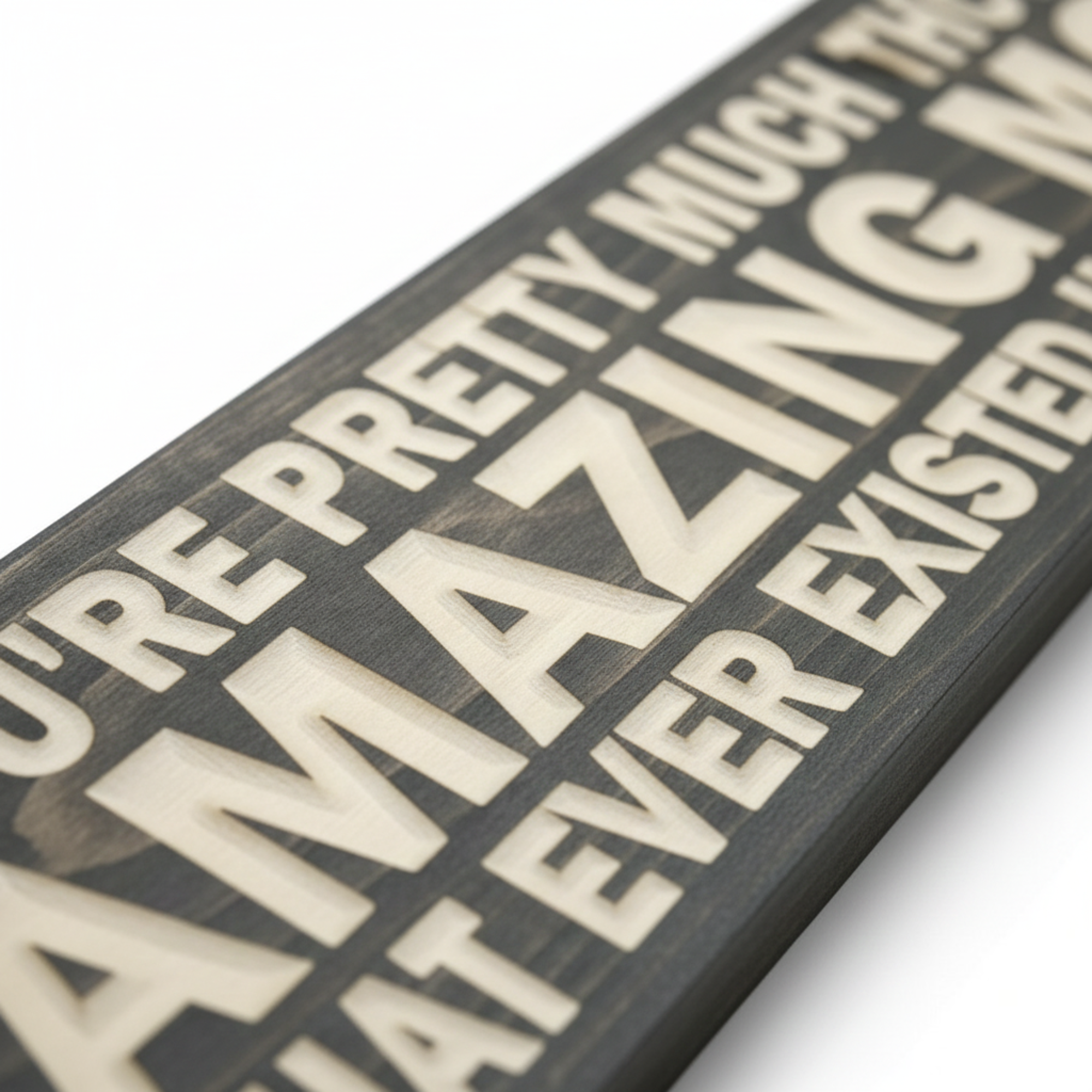 Close-up macro shot showing the deep CNC-carved detail of a handcrafted Bluegrass Gifts wooden sign.