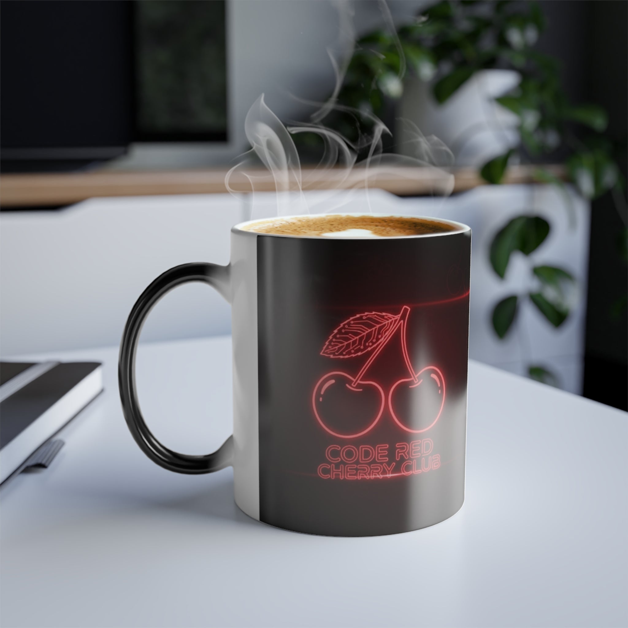 Code Red Cherry Club magic mug on desk with coffee — glowing neon cherry design revealed by heat.