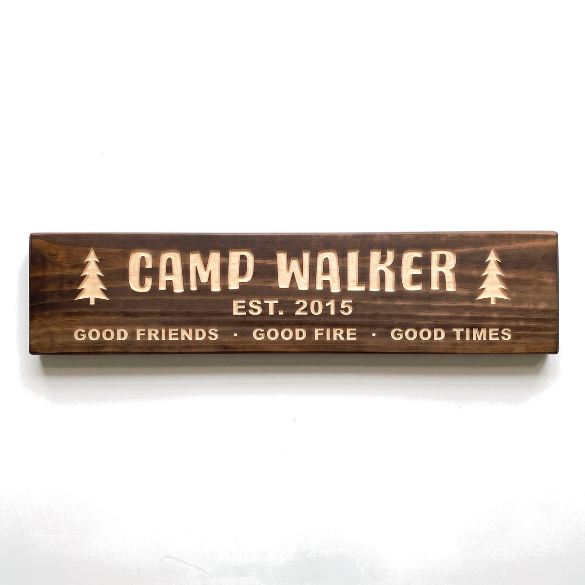 Personalized Camp Walker sign carved into solid wood in a Dark Walnut finish, straight on, on a white background (studio photo)