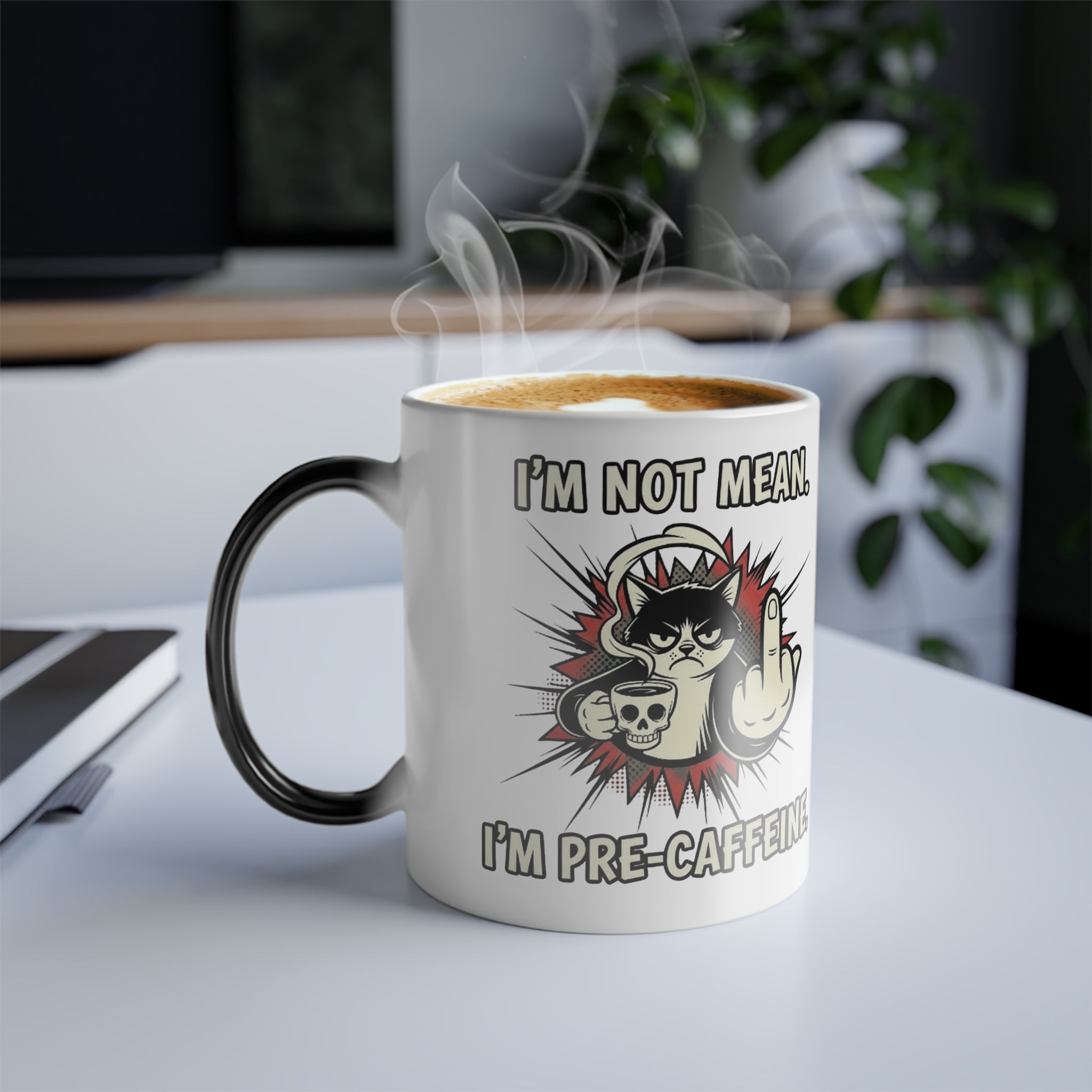 Lifestyle shot of the fully revealed grumpy cat magic mug on a clean white desk, ideal funny gift for a coworker.
