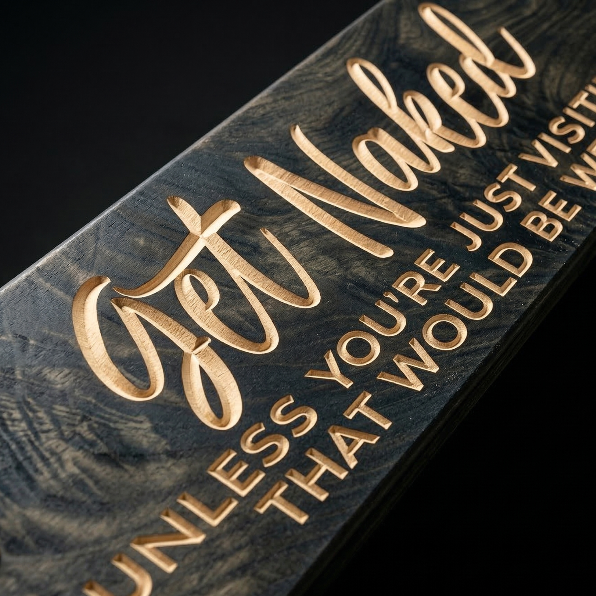 Close-up of deep CNC-carved lettering on "Get Naked" funny bathroom wood sign showing natural wood grain contrast against dark ebony finish – handmade by Bluegrass Gifts