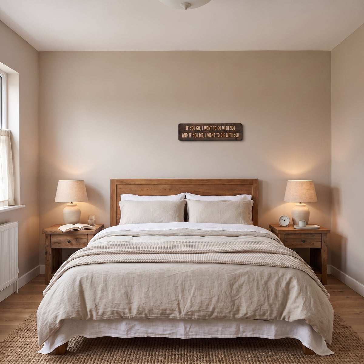 The If You Go, I Want to Go With You sign hanging above a wooden headboard in a quiet bedroom
