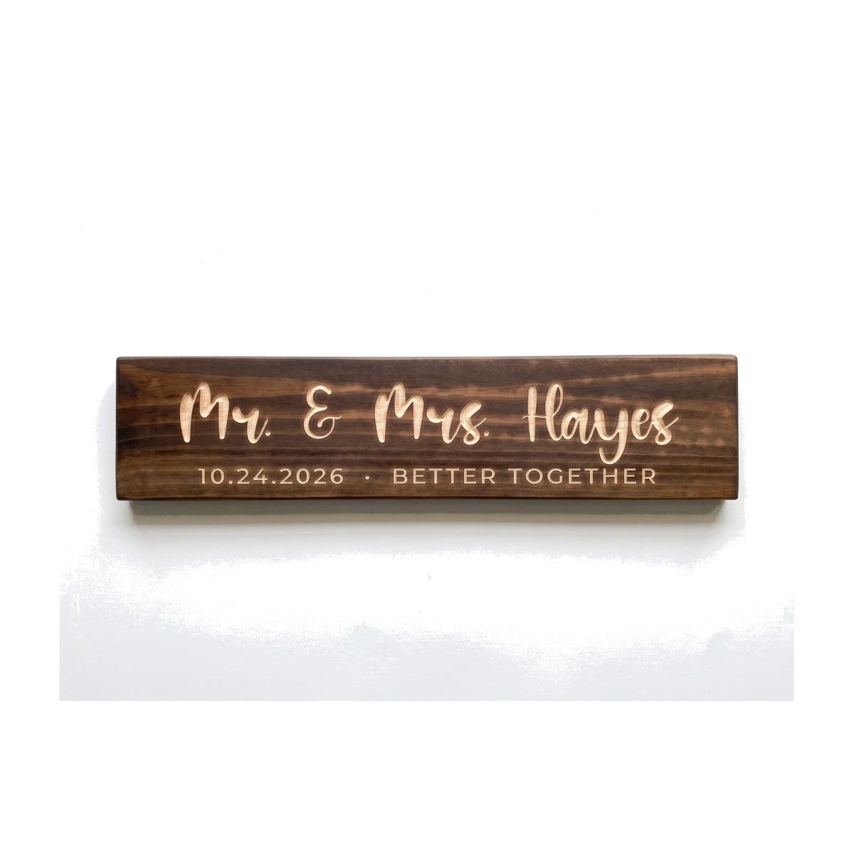Personalized Mr. & Mrs. Hayes sign carved into solid wood in a Dark Walnut finish, straight on, on a white background (studio photo)