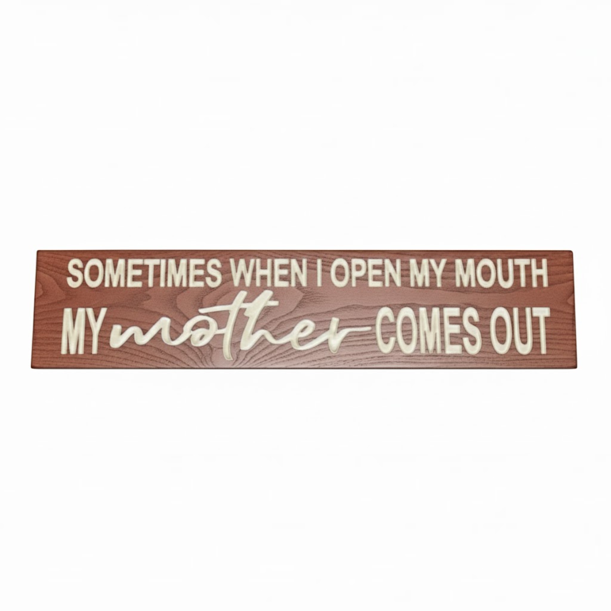 Flat lay view of a "Sometimes When I Open My Mouth My Mother Comes Out" carved wood sign on a white background.