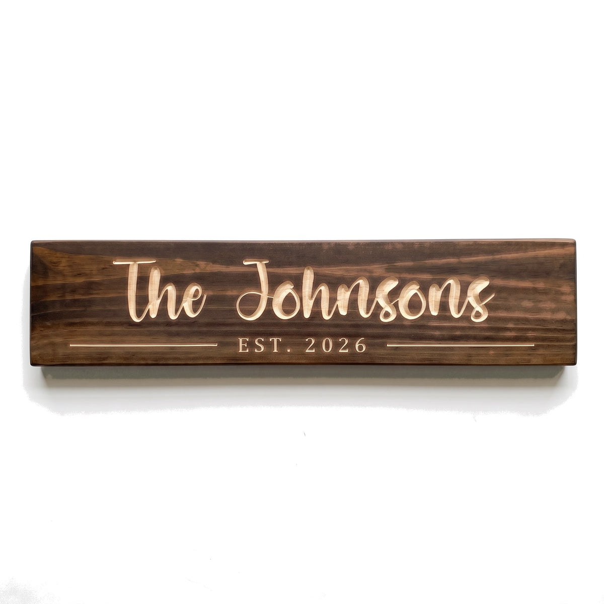 Personalized The Johnsons sign carved into solid wood in a Dark Walnut finish, straight on, on a white background (studio photo)
