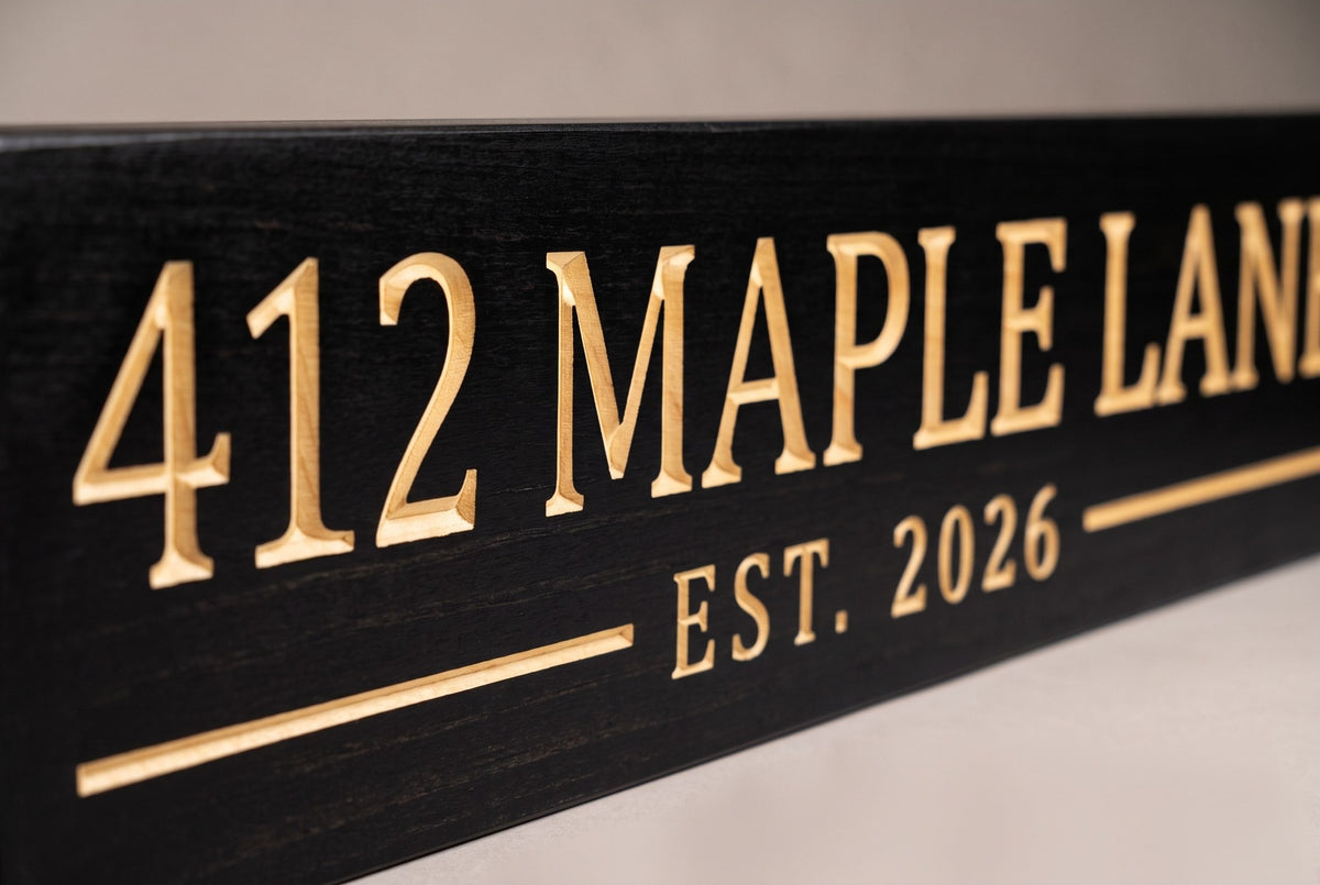 Personalized house address sign carved lettering close-up