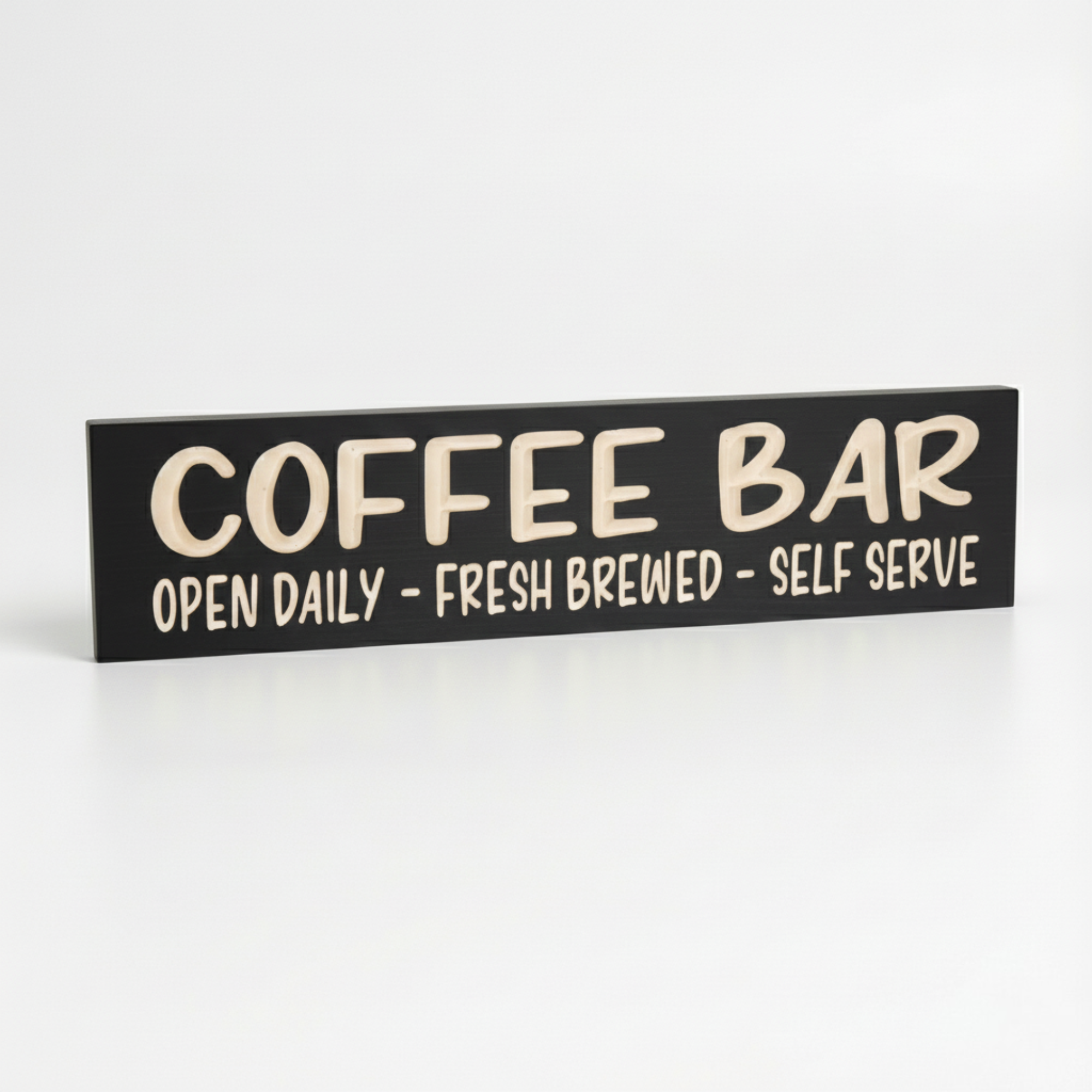 Angled view of the black finished Coffee Bar sign showing the solid wood thickness and heirloom quality.