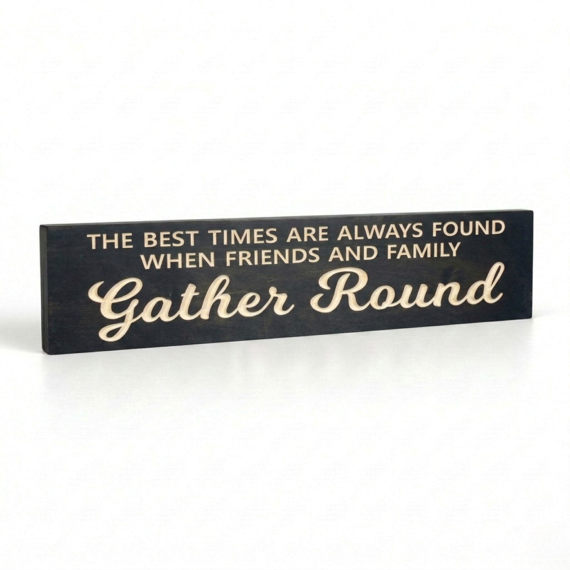 Angled view of "The Best Times Are Always Found When Friends and Family Gather Round" CNC-carved wood sign in Ebony finish.
