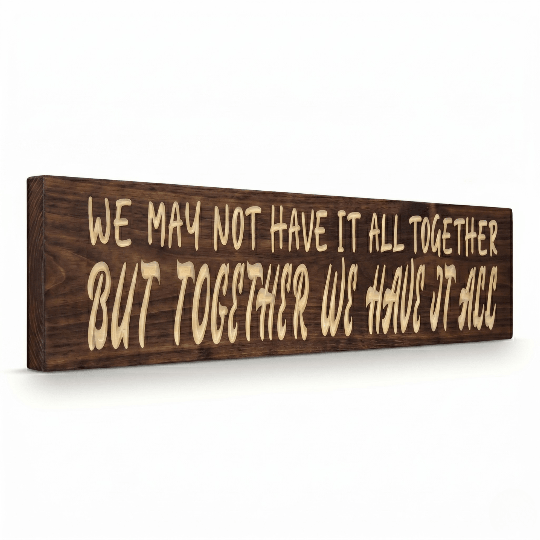 Angled side view of the We May Not Have It All Together carved wood sign showing the dimensional 2.5D depth of the routed lettering on Dark Walnut