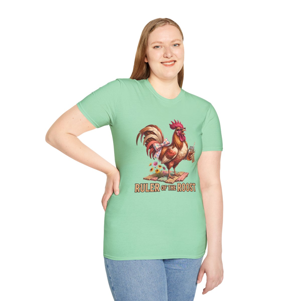A woman stands smiling, modeling the light green fitted Rooster Shirt - Ruler of the Roost, with her hand on her hip