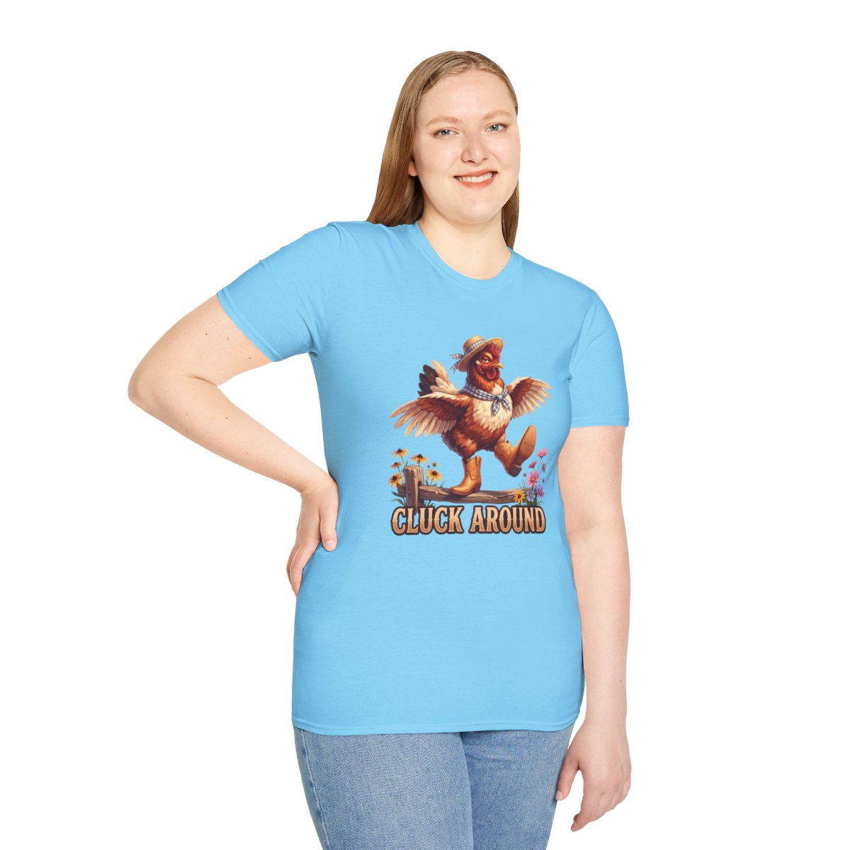 A smiling woman stands with one hand on her hip, modeling the light blue Chicken Shirt - Cluck Around