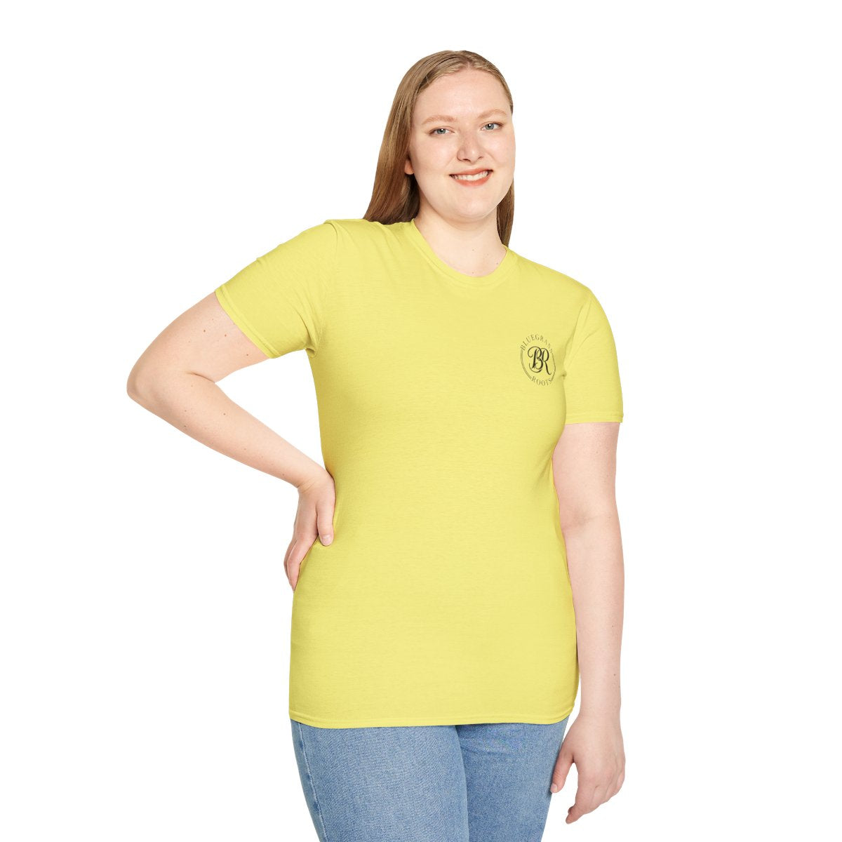 A woman smiling, looking forward, wearing a yellow Sweet Tea Shirt with the small "Bluegrass Roots" logo on the left chest