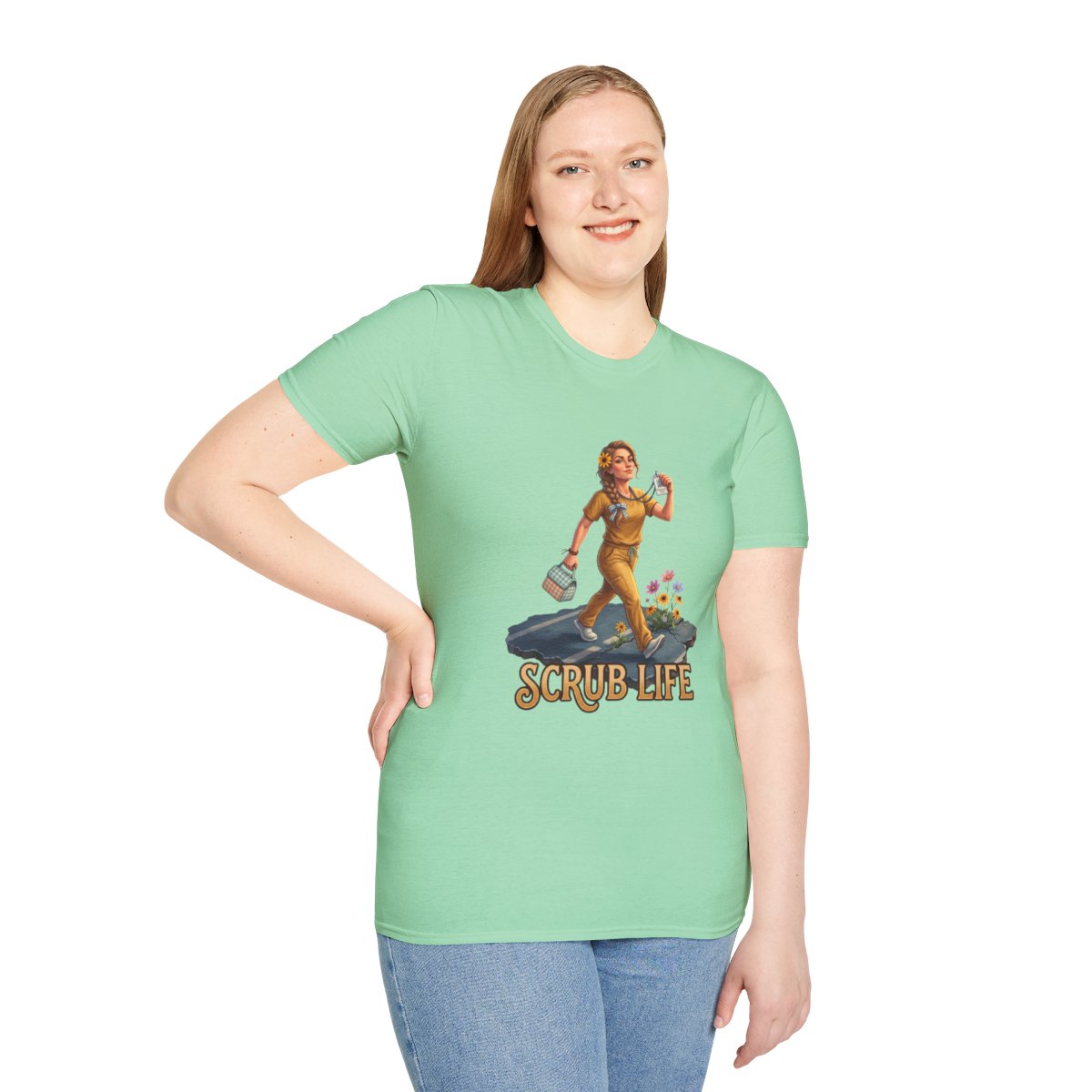 A smiling woman with light brown hair models a light mint green "Nurse Shirt - Scrub Life" tee on a white background, left hand on hip