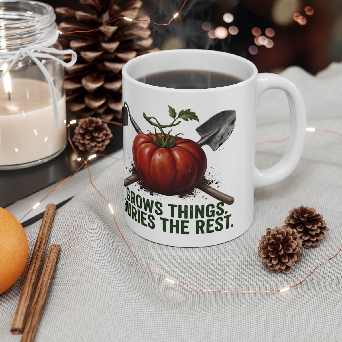 Grows Things, Buries the Rest heirloom tomato gardening mug styled with a candle — Bluegrass Gifts trades and hobbies mugs