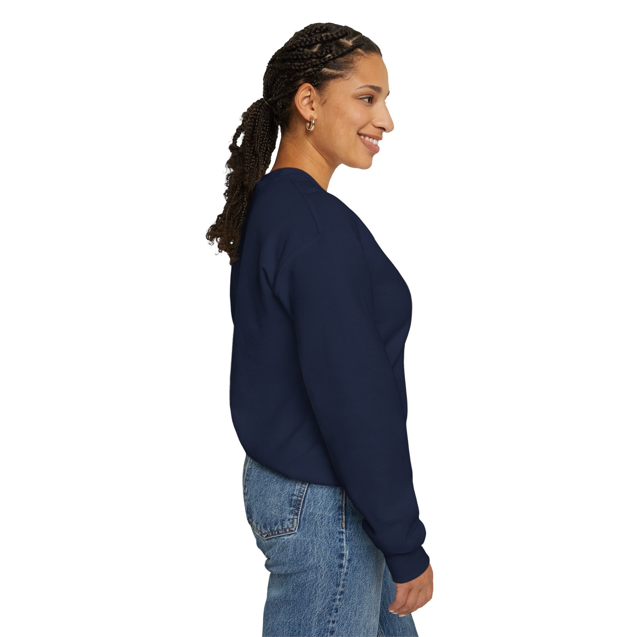 Woman wearing a navy blue sweatshirt and jeans on a white background
