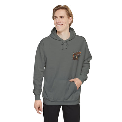 Person wearing a gray hoodie with a small design on the chest against a white background