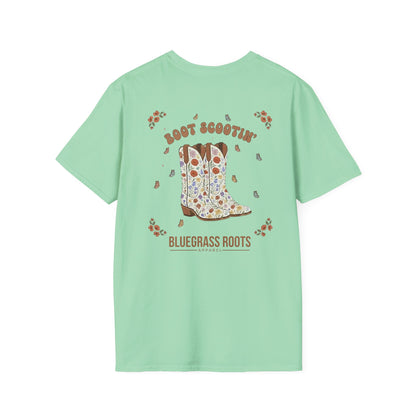 Light green t-shirt with a graphic of cowboy boots and text on the back, on a white background.