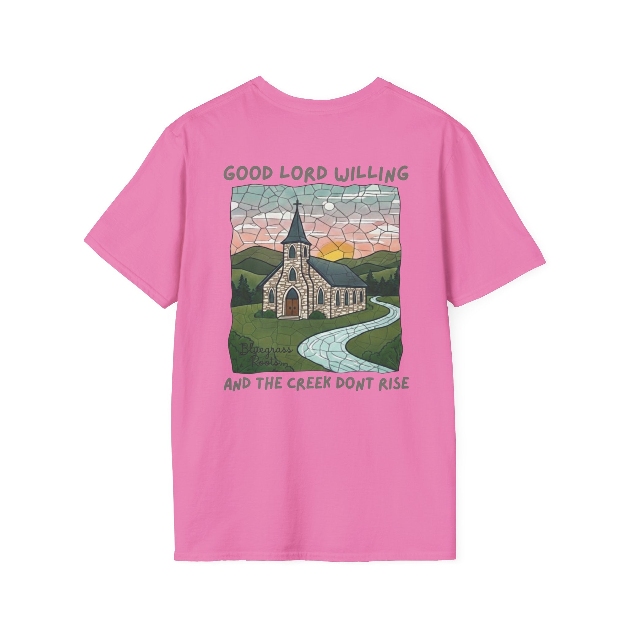 Pink t-shirt with a graphic design of a church and landscape on the back, on a white background.