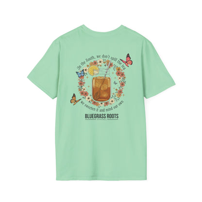 Light green t-shirt with a graphic design on the back featuring a glass of iced tea, flowers, and butterflies, with 'Bluegrass Roots' branding.