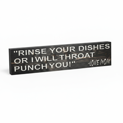 Angled view showing the 3D texture and thick solid wood profile of the "Rinse Your Dishes Or I Will Throat Punch You!" sign.