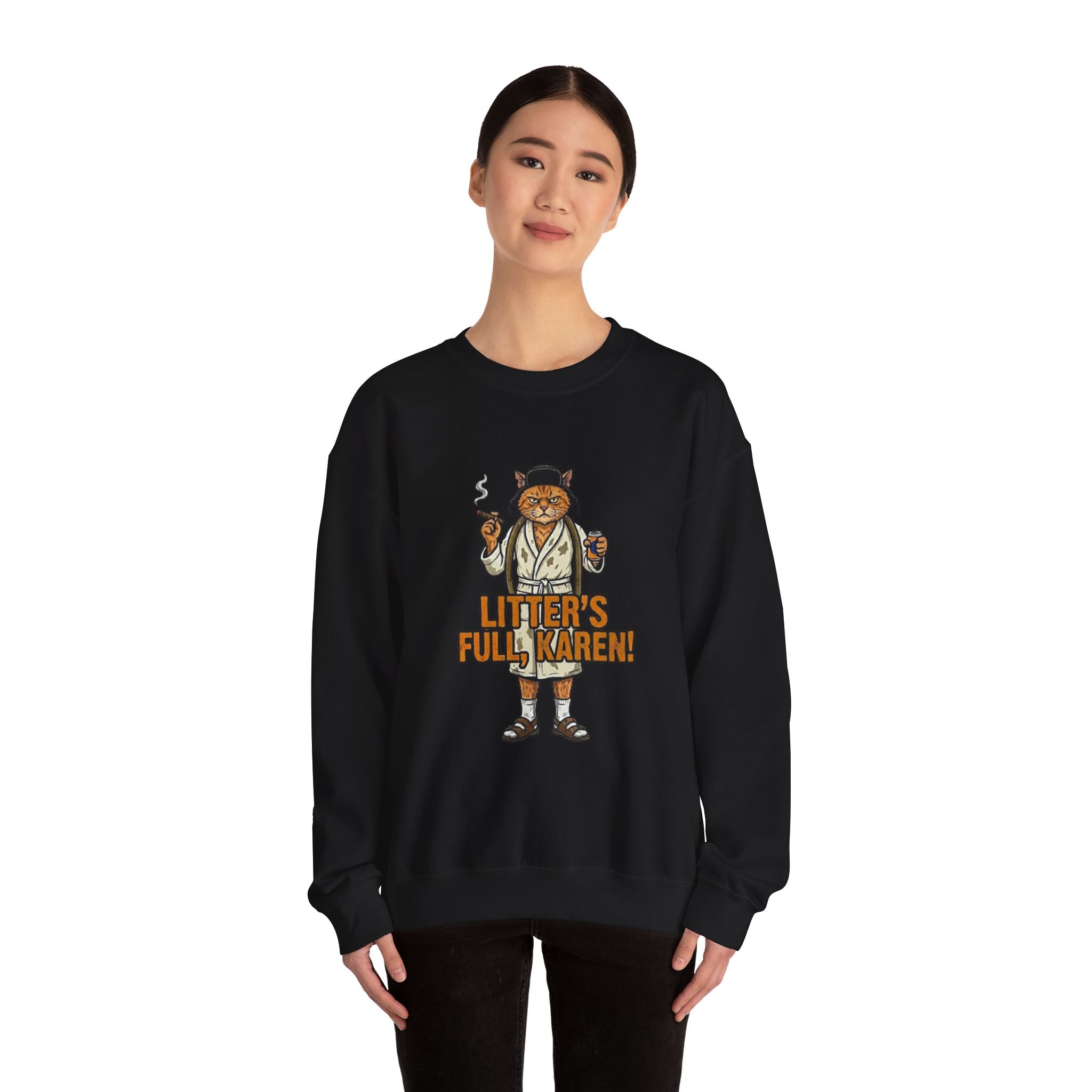 Person wearing a black sweatshirt with a cat graphic and text on a white background