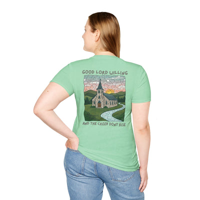 Person wearing a green t-shirt with a graphic design and text on the back