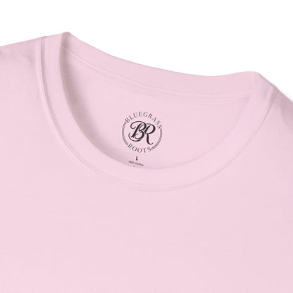 Close-up of a pink t-shirt with 'Bluegrass Roots' logo on a white background