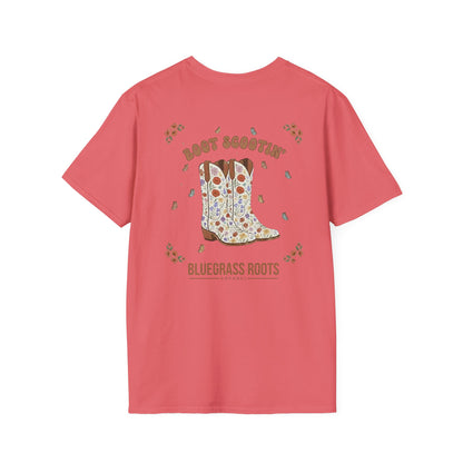 Pink t-shirt with a graphic of cowboy boots and text on a white background