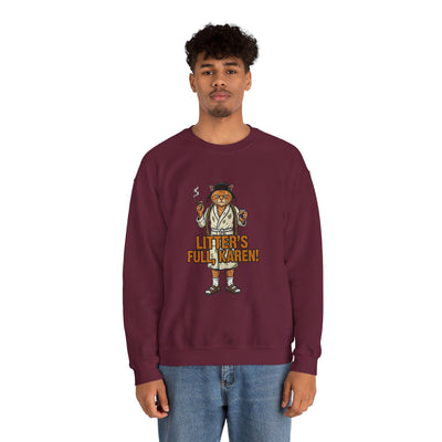 Person wearing a maroon sweatshirt with a graphic design and text on a white background