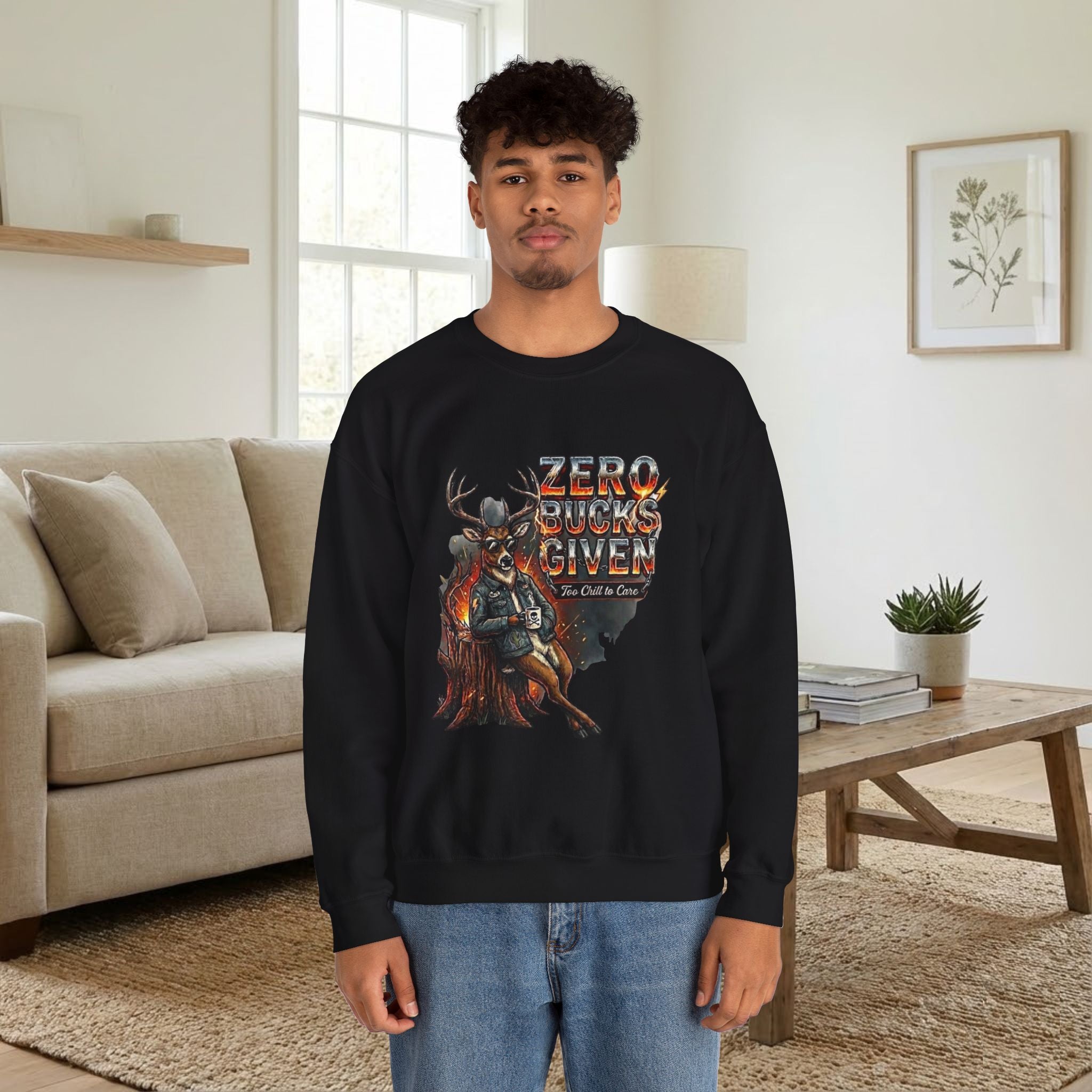 Person wearing a black sweatshirt with a graphic design in a living room.