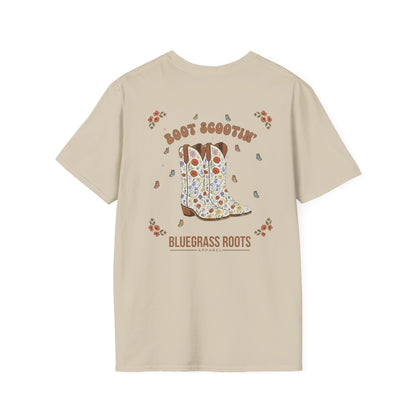 Beige t-shirt with a graphic of a cowboy boot and text on the back, on a white background