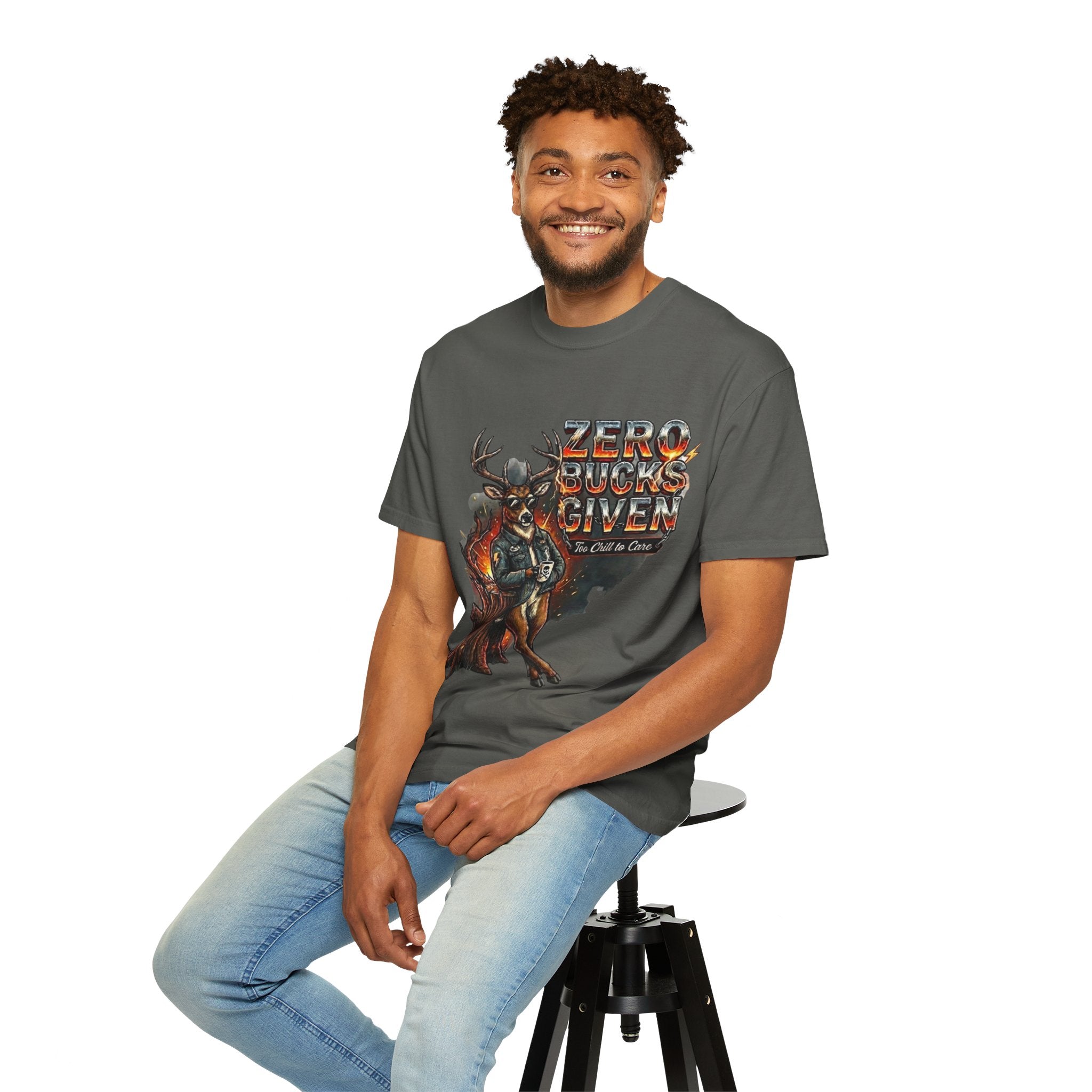 Man wearing a gray t-shirt with 'Zero Bucks Given' graphic design, sitting on a stool against a white background.
