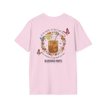 Pink t-shirt with a graphic design on the back featuring a glass of lemonade, flowers, and butterflies.